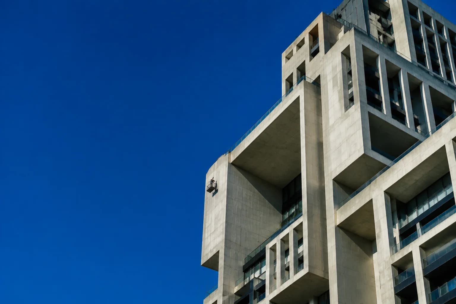 A geometric high-rise against the sky